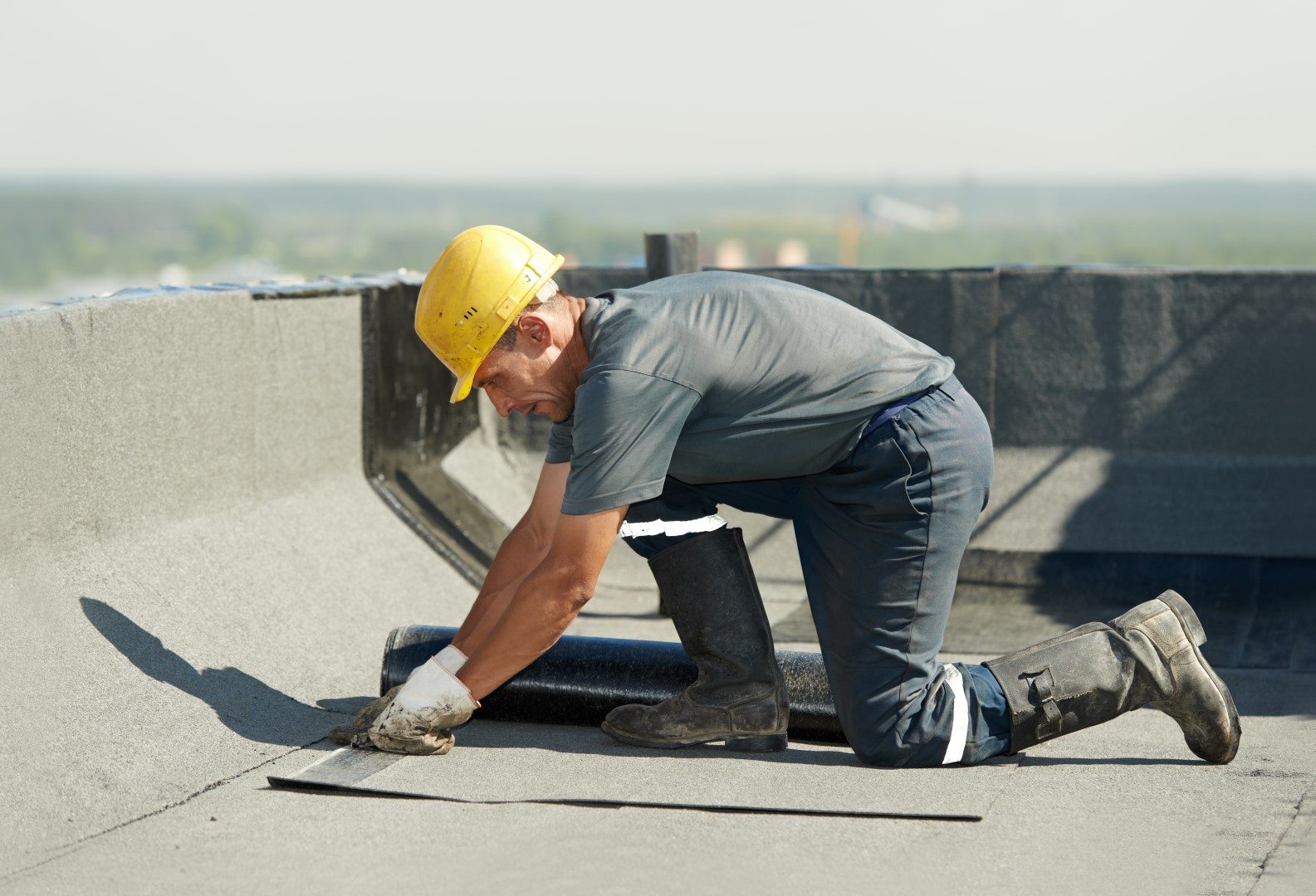 Image depicts a roofer repairing a roof.